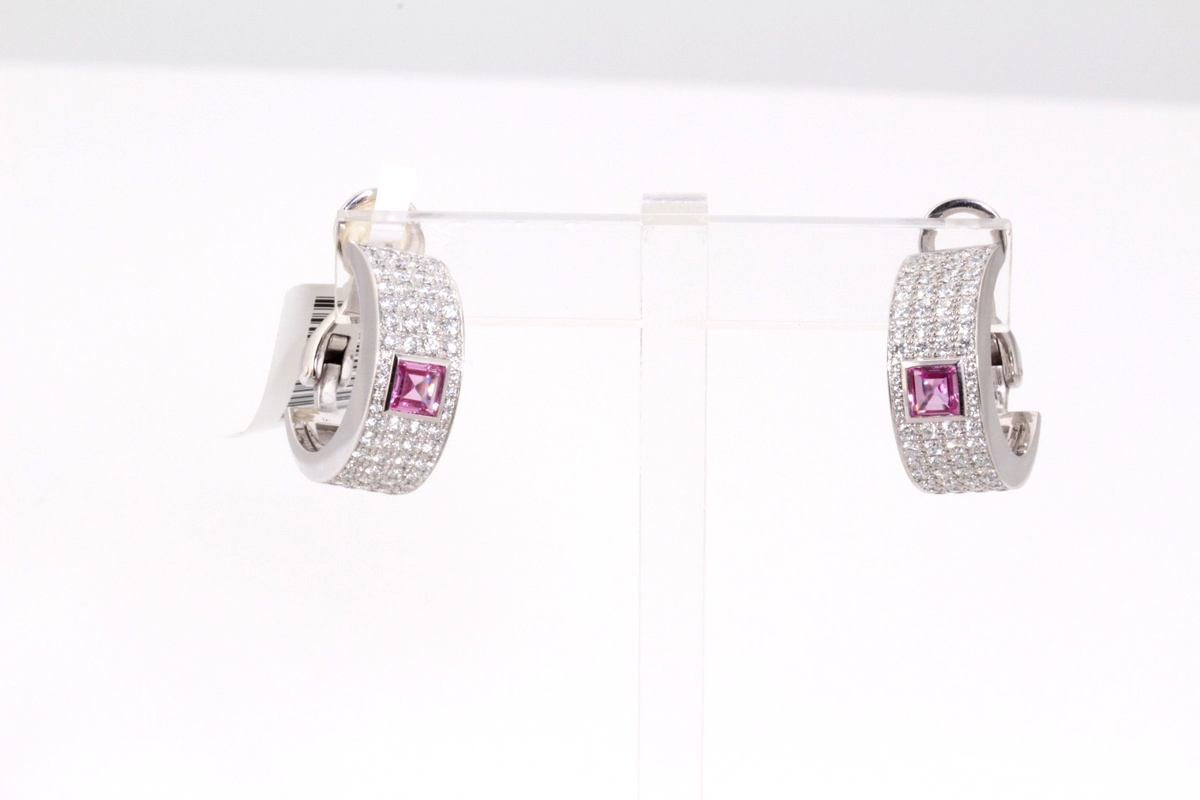 Offered is an authentic pair of Chopard high-jewelry hoop earrings, crafted in 1