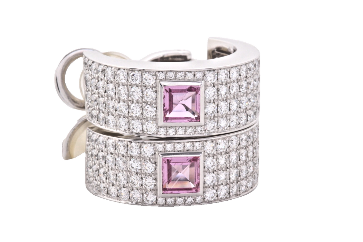 Offered is an authentic pair of Chopard high-jewelry hoop earrings, crafted in 1